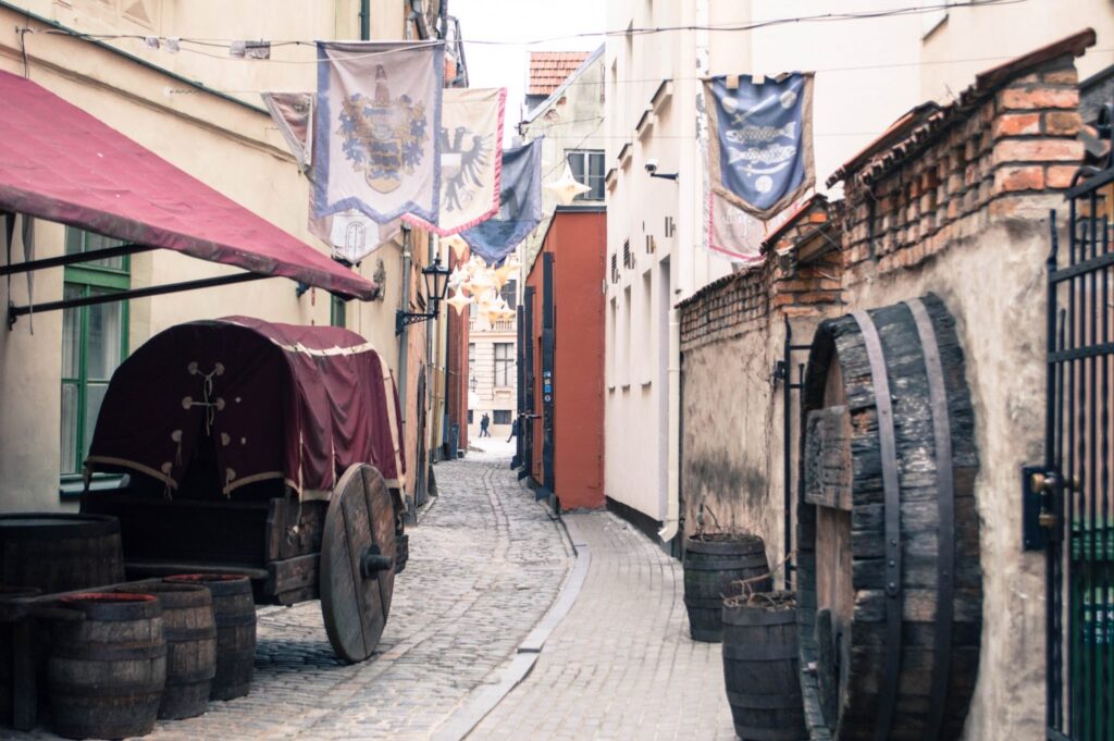 Rozena street covered in Medieval flags in Riga Old Town