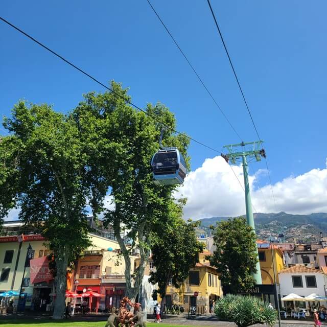 A cable car going above a town