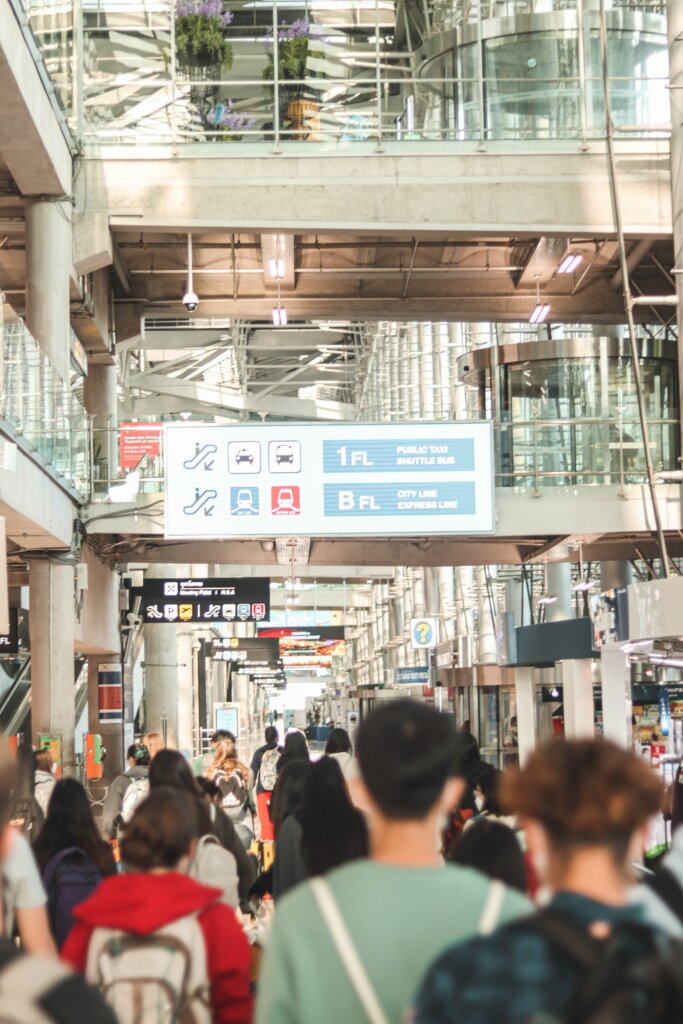 Crowds walking in an Asian airport