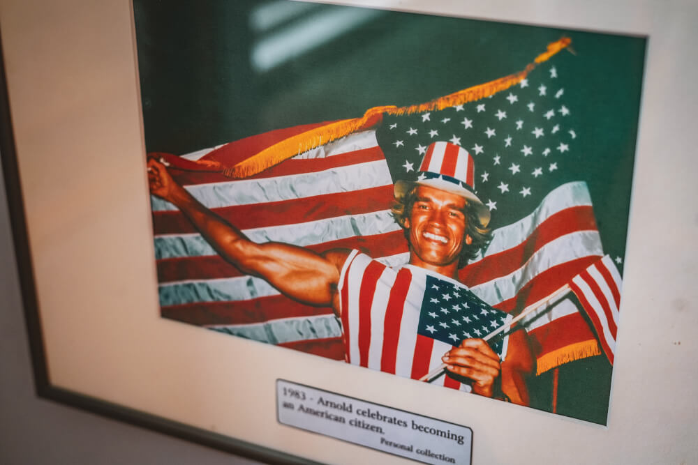 Arnold getting his American citizenship photo at the Arnold Schwarzenegger Museum in Thal, Austria