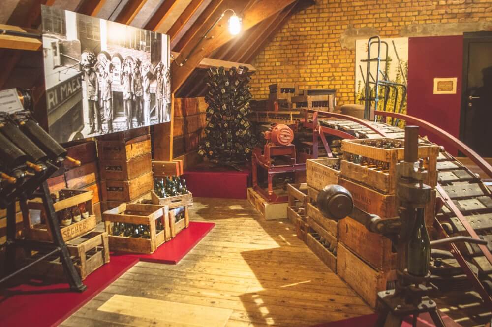 Display room with old bottles in the De Halve Maan Brewery in Bruges, Belgium