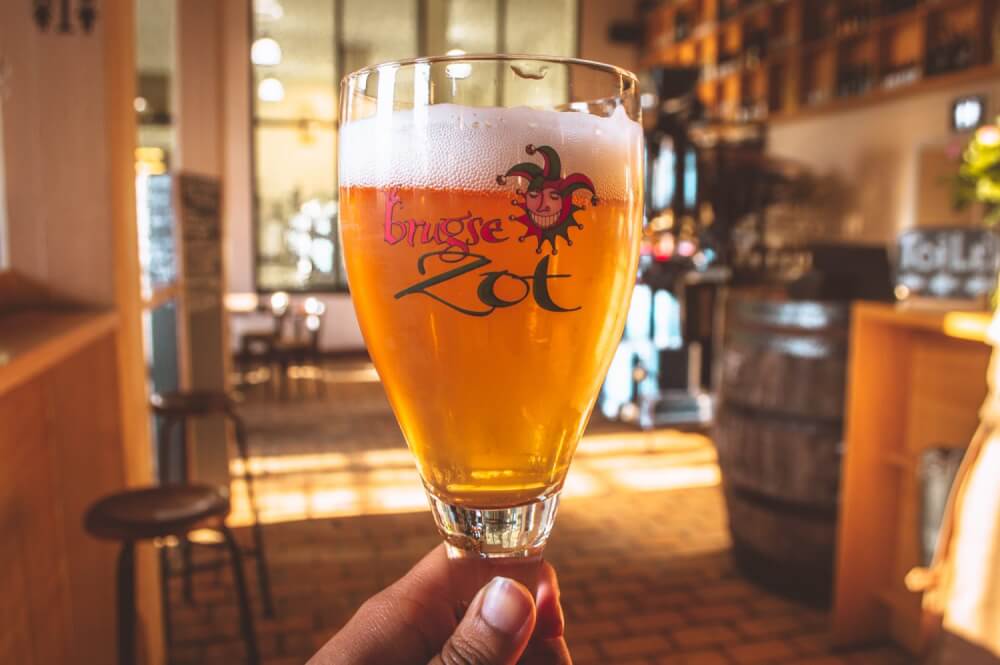 Glass of Brugse Zot beer in Bruges Belgium