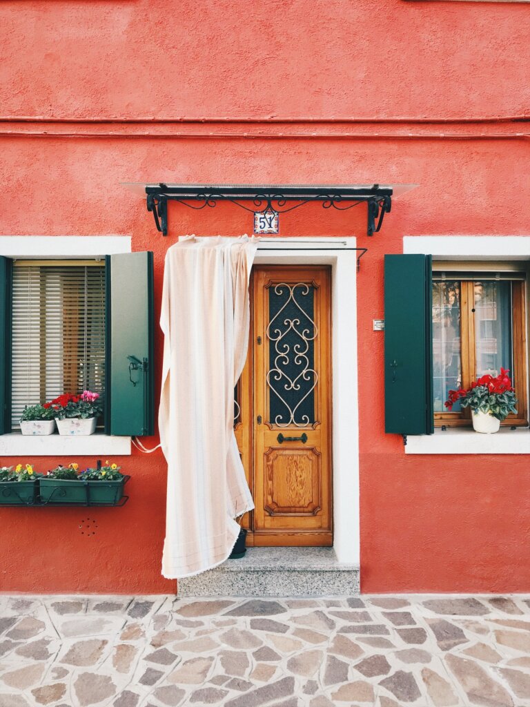 Orange facade of a house in Burano, Italy