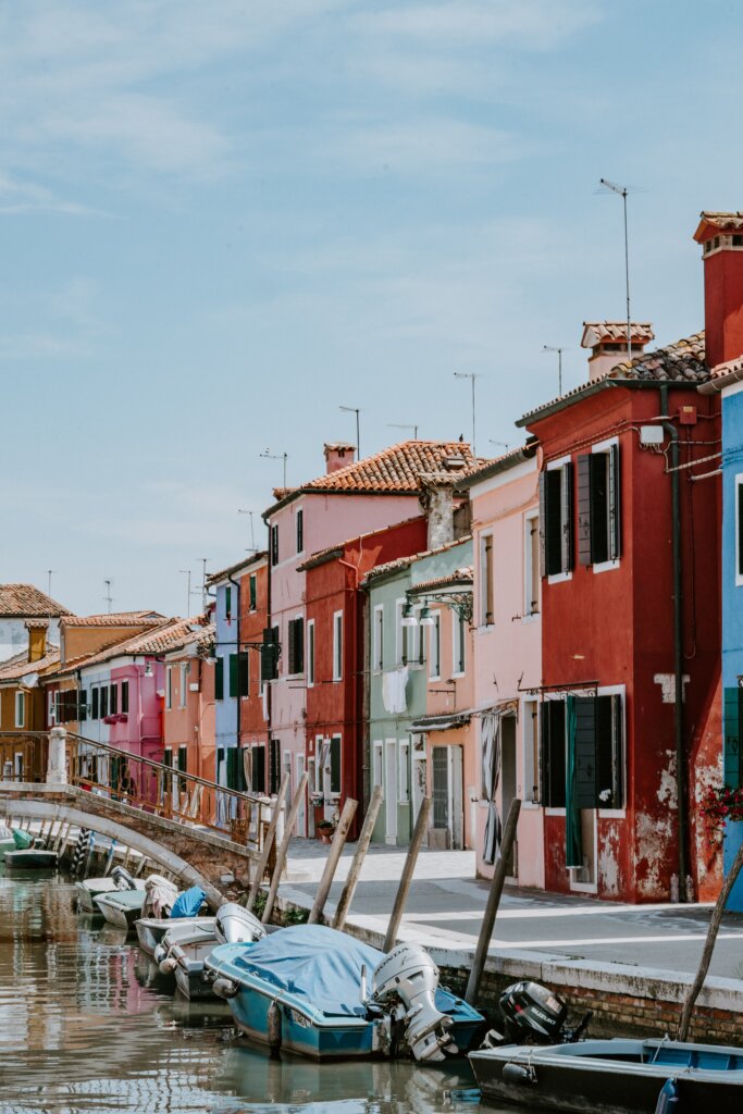 Colourful houses next to a bridge and canal in Burano, Italy