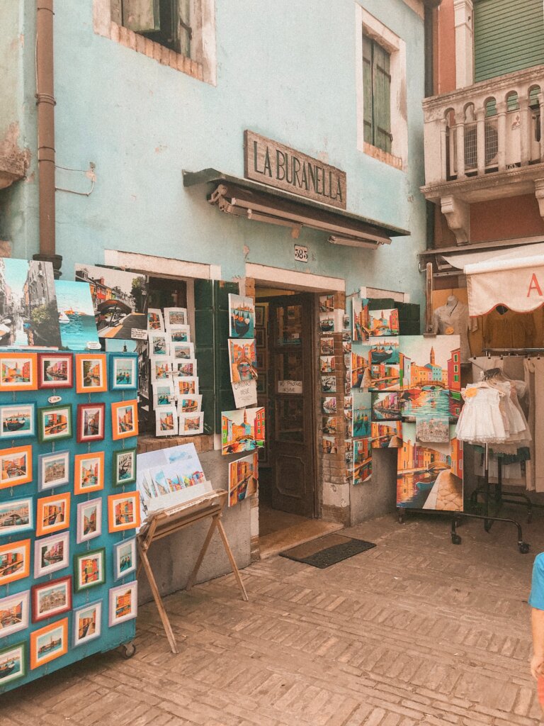 Souvenir shop in Burano selling paintings and magnets