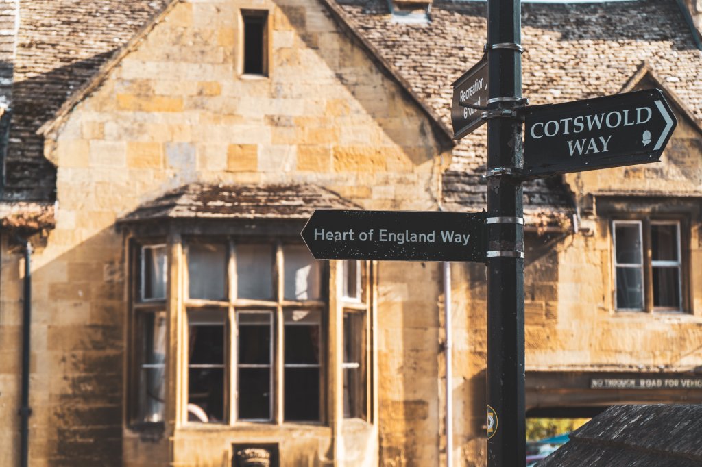 Street signs pointing out the Heart of England Way and Cotswold Way in Chipping Camden, England