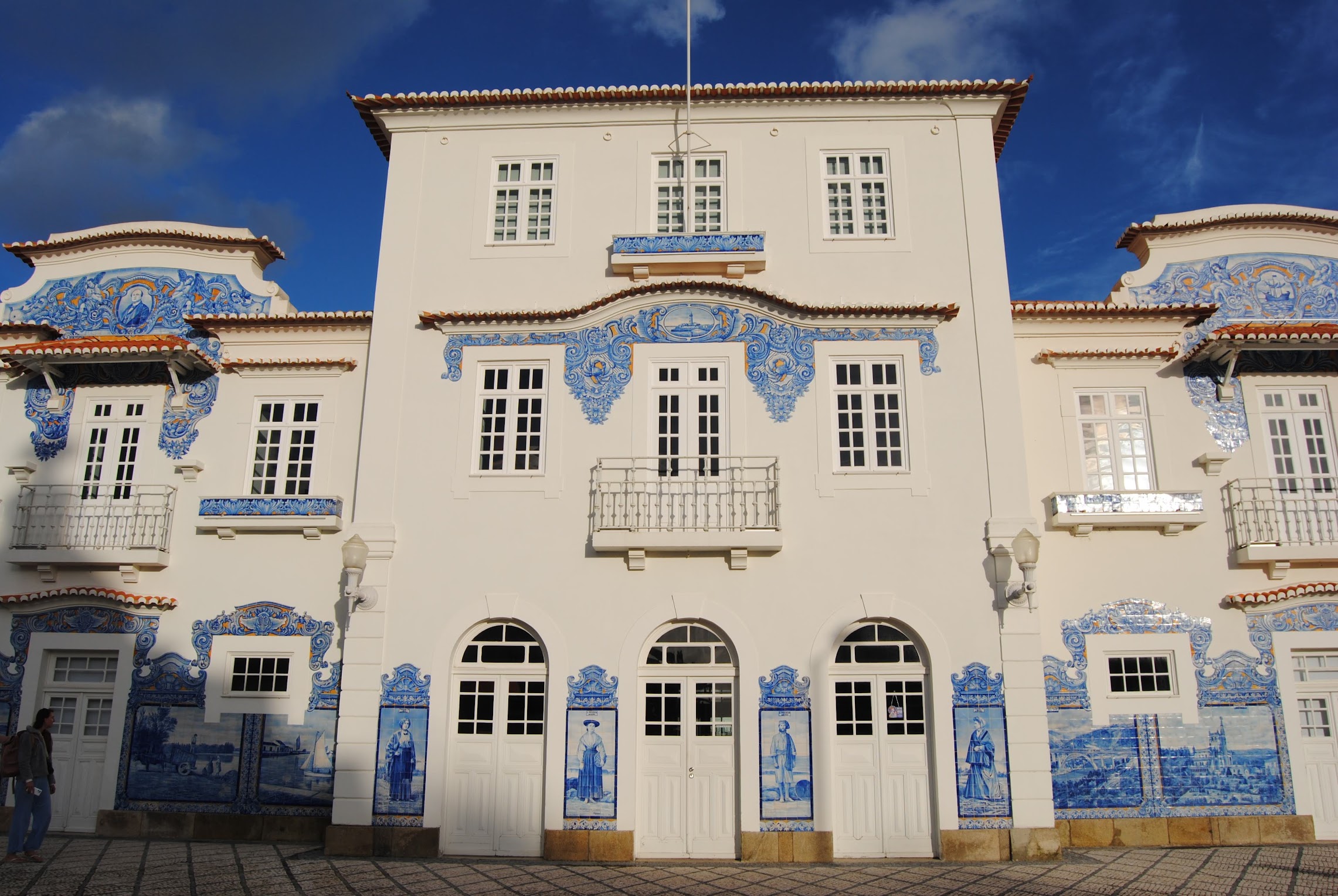 A blue and white tiled train station