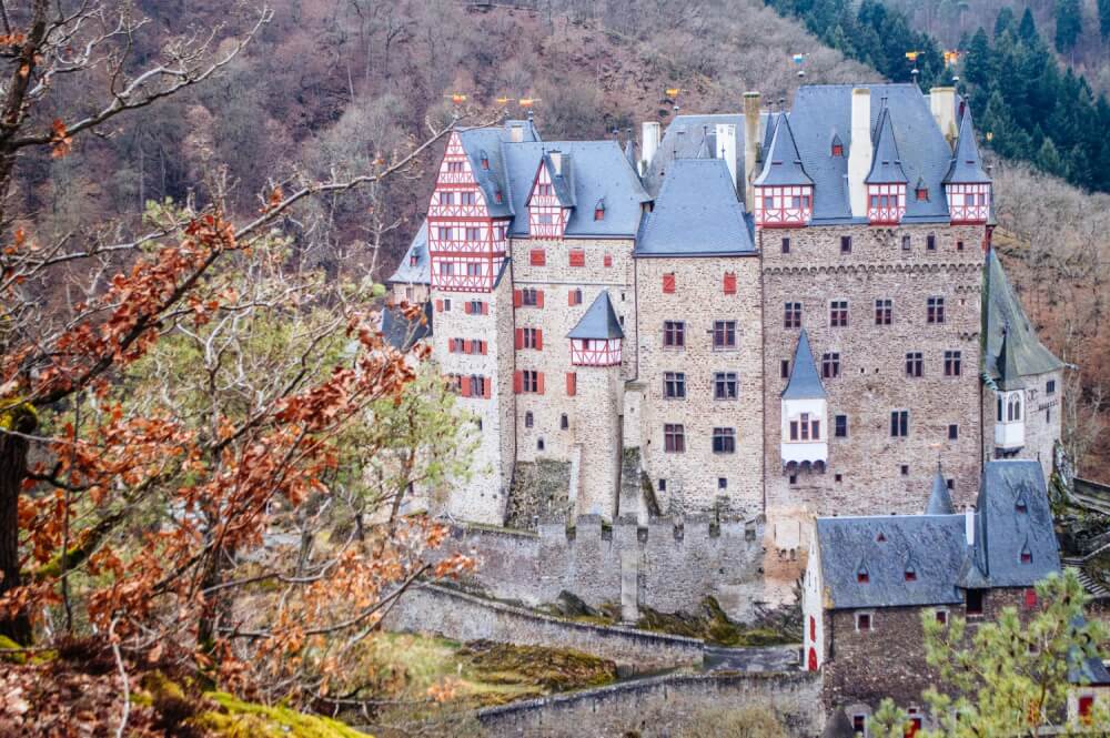 Burg Eltz Castle (Burg Eltz in German, Eltz Castle in English) is by far one of the prettiest fairytale castles in Germany. Click through for a comprehensive guide on visiting Burg Eltz Castle for yourself, including how to get there, what to do there and where to get the best views.