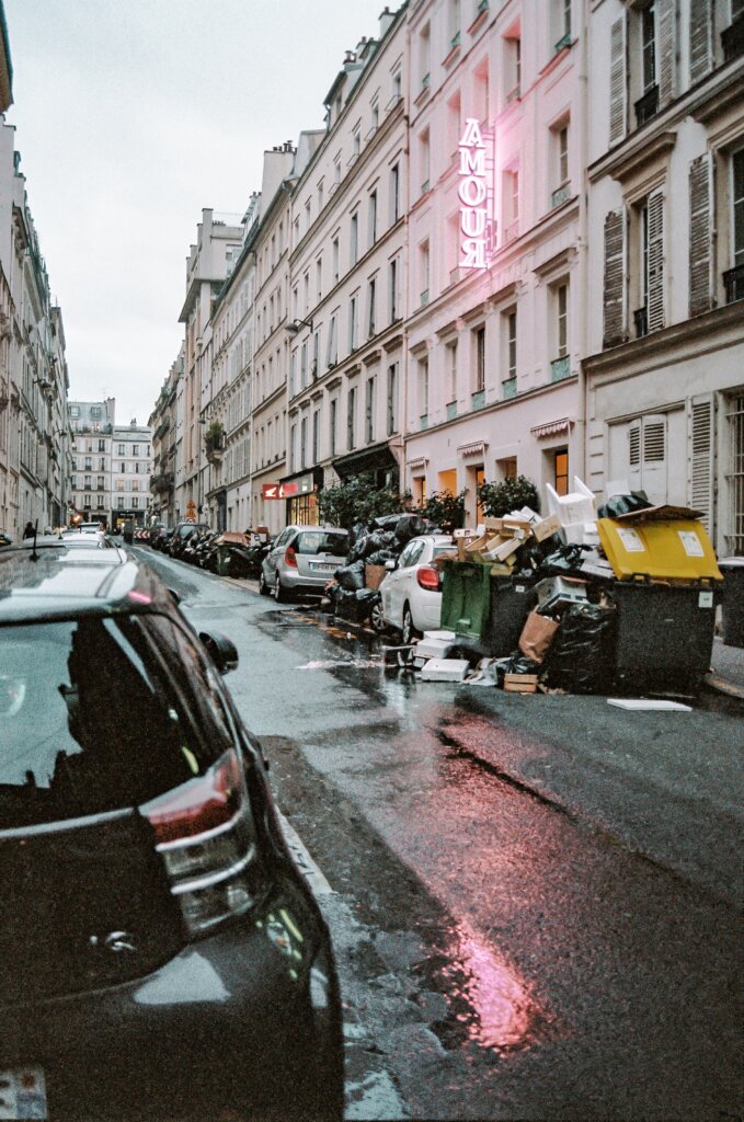 Dumpsters full of garbage on a street in Paris, France