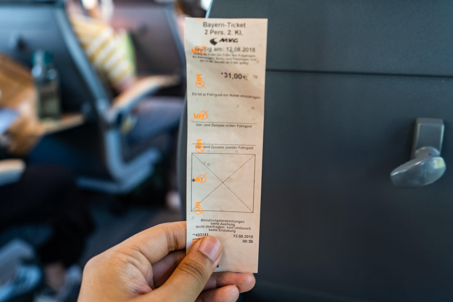 Bayern ticket for two people held out in a train