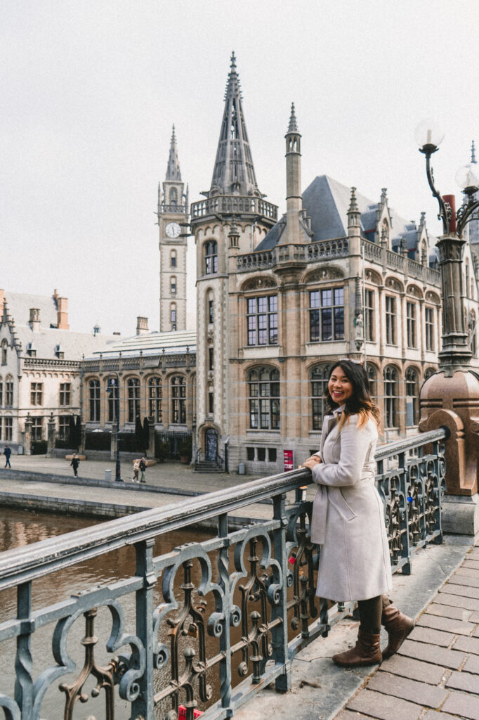 Travel blogger on St Michael's Bridge in Ghent