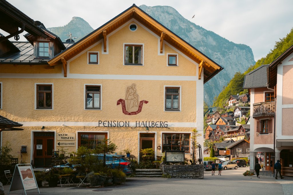 A large yellow pension house in Hallstatt, Austria.