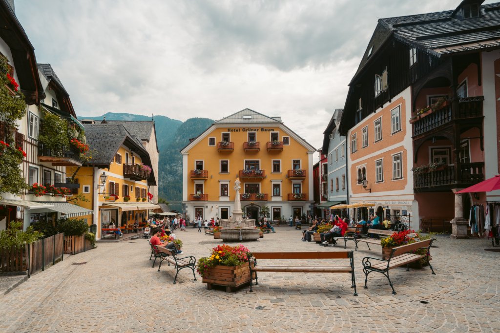 A buzzing Marktplatz filling up with people in Hallstatt, Austria.