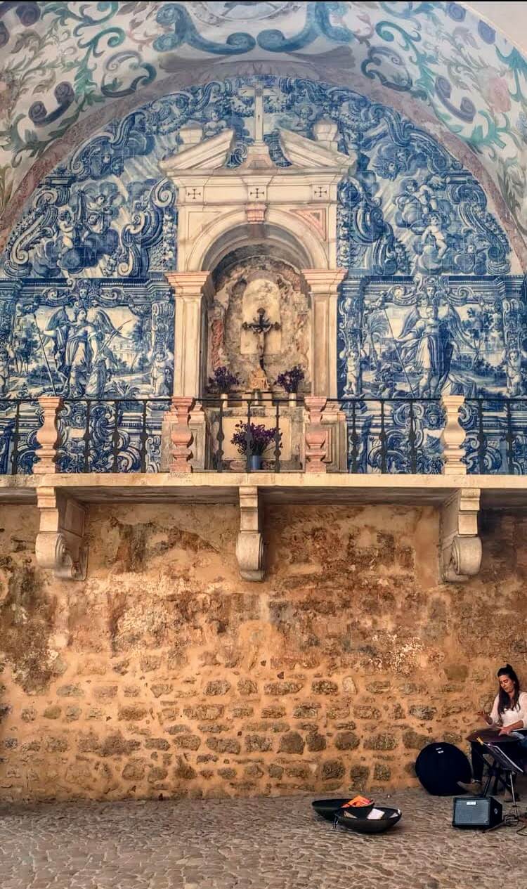 An outdoor chapel, decorated with blue and white tiles