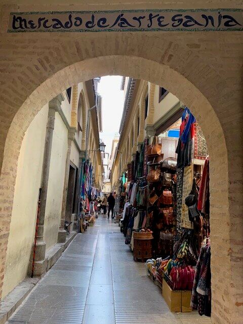 The arched doorway that leads to an indoor/outdoor marketplace