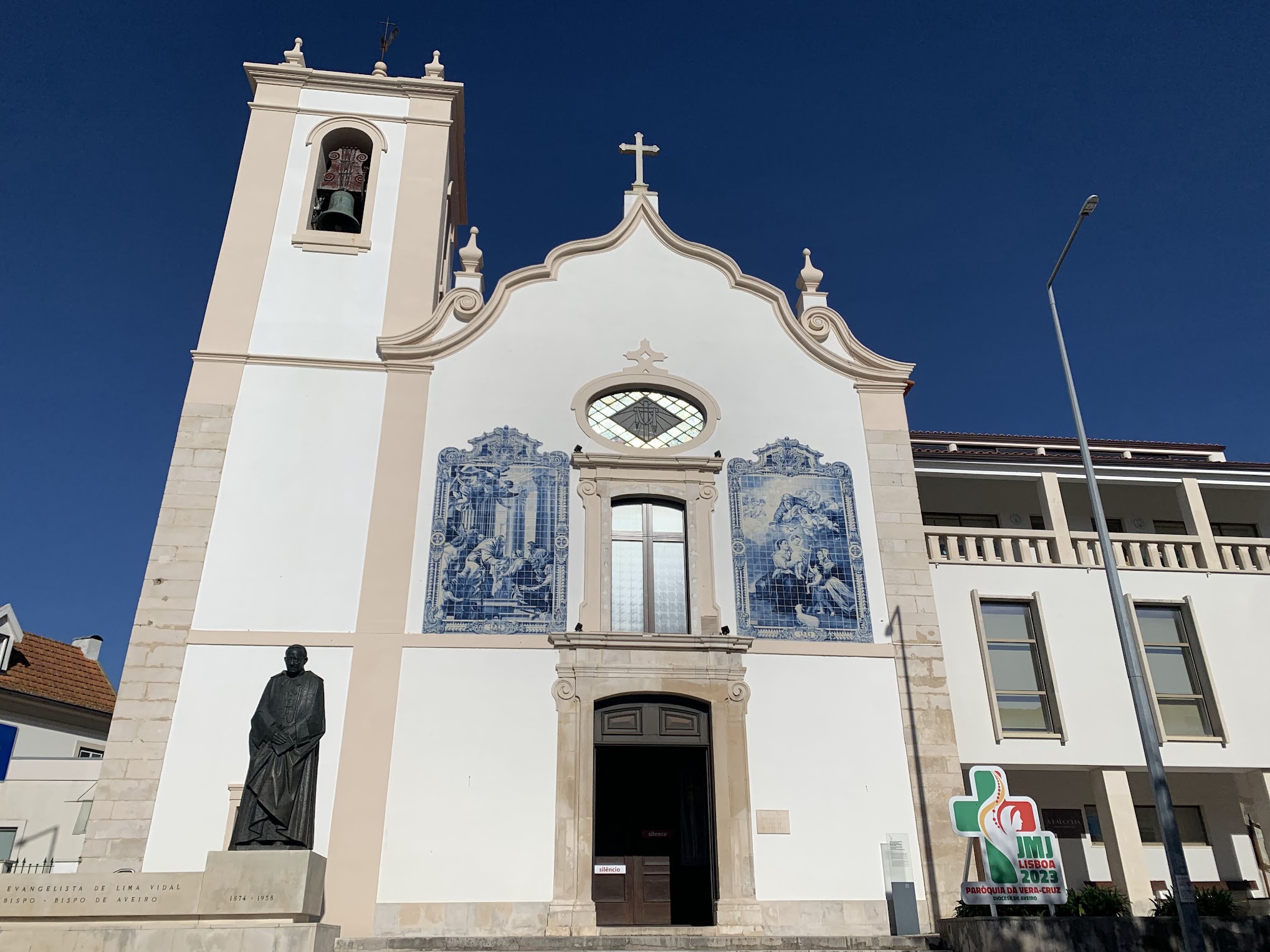 A white church with blue and white tiles 