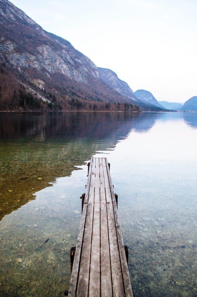 Lake Bohinj, Slovenia is one of THE most magical and serene lakes in the whole world. Here's an easy guide on how to get the best views of this massive lake (Slovenia's largest), including a map on how to get to the best spot for photos.