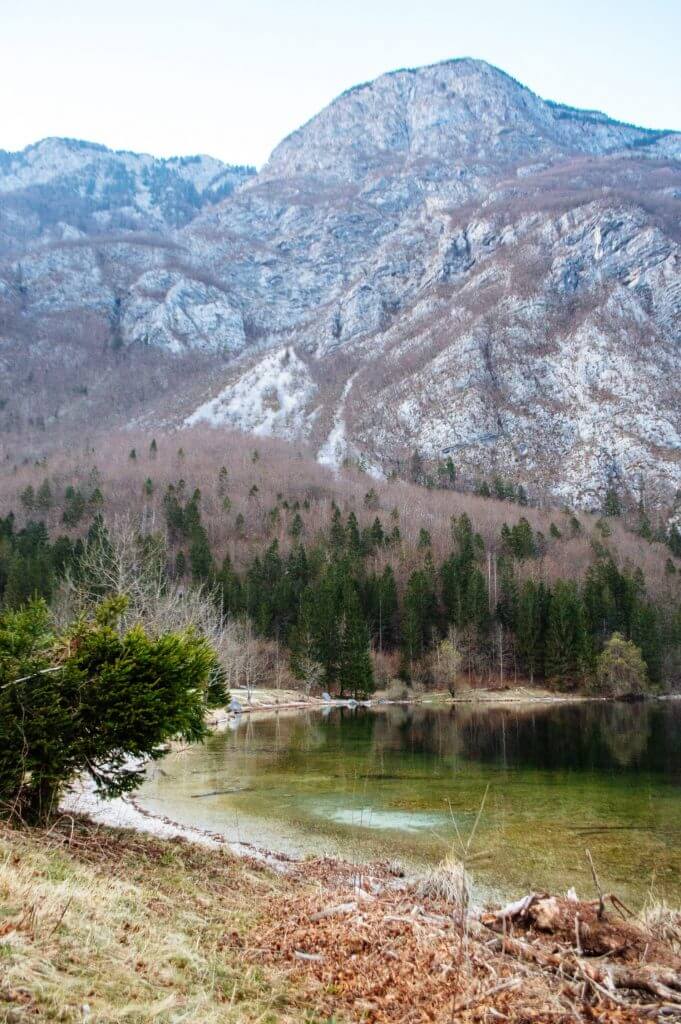 Lake Bohinj, Slovenia is one of THE most magical and serene lakes in the whole world. Here's an easy guide on how to get the best views of this massive lake (Slovenia's largest), including a map on how to get to the best spot for photos.