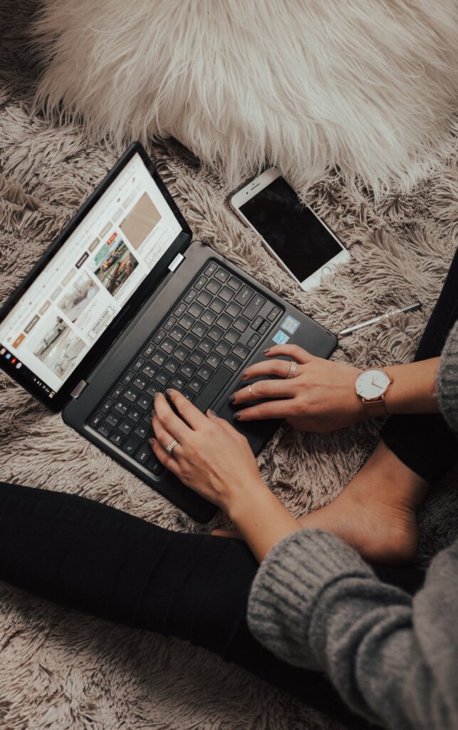 Woman sitting on the floor on her laptop