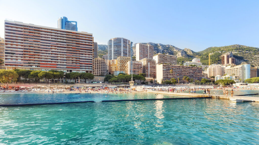 Beach with bright blue water in Monaco