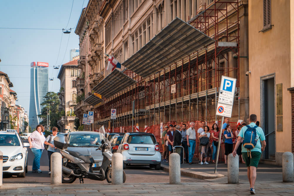 Tourists waiting in a line-up outside the Last Supper in Milan