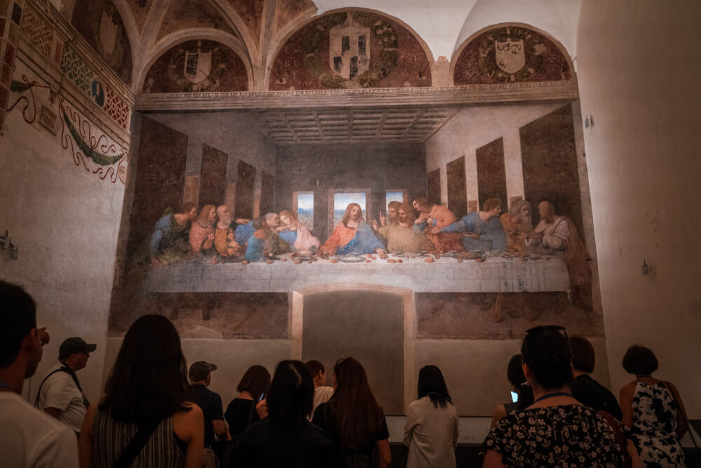 Tourists looking at the Last Supper in Milan, Italy