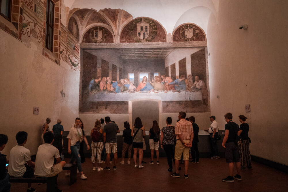 Tourists admiring the Last Supper in Milan