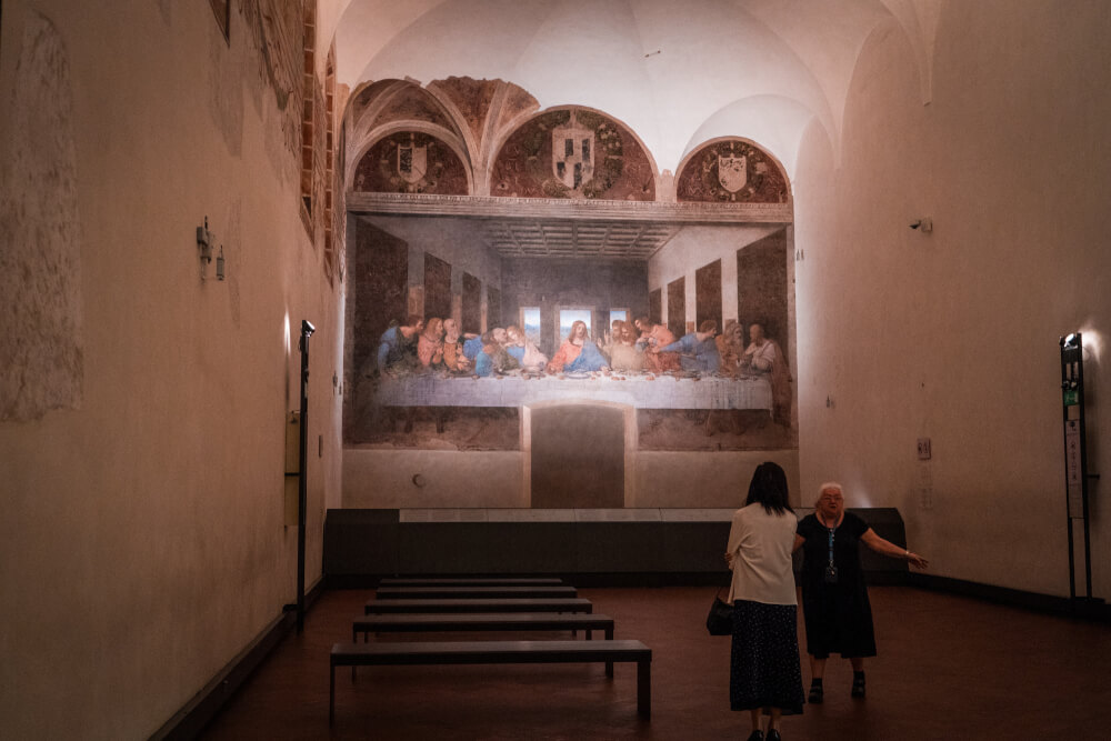 Tourists looking at the Last Supper in Milan, Italy