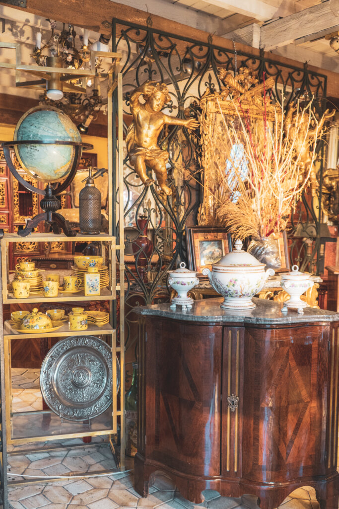 Old globes and antiques on display at the flea market in Saint Ouen in Paris