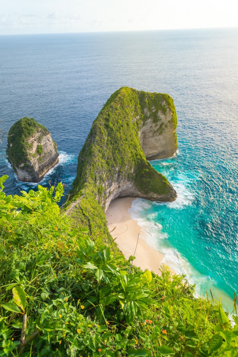 Beautiful sunset and amazing view of Kelingking beach or Manta bay on Nusa Penida island, Bali, Indonesia