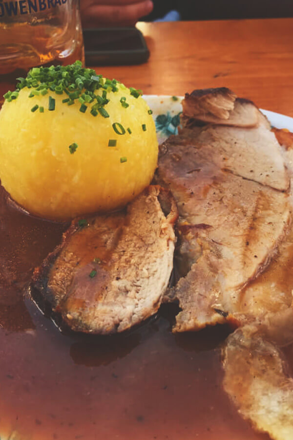 Schweinebraten with potato dumpling at Oktoberfest in Munich, Germany.