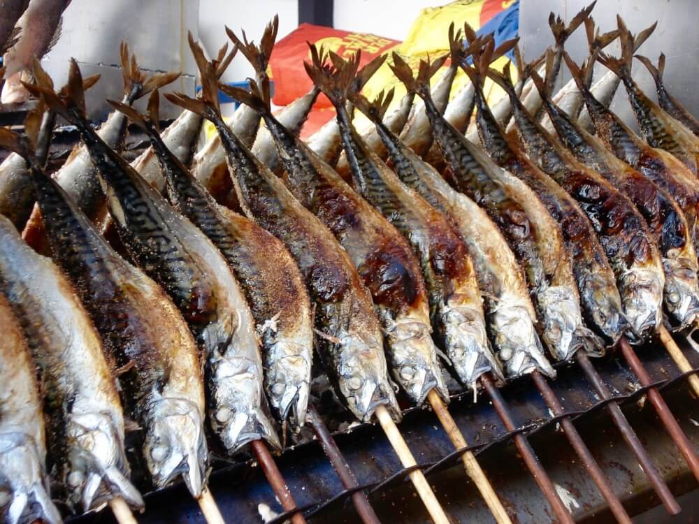 Tasty roasted fish on a stick at Oktoberfest in Munich, Germany.