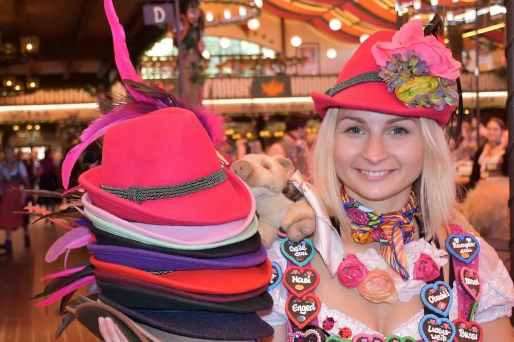 Woman selling hats and souvenirs at Oktoberfest in Munich, Germany