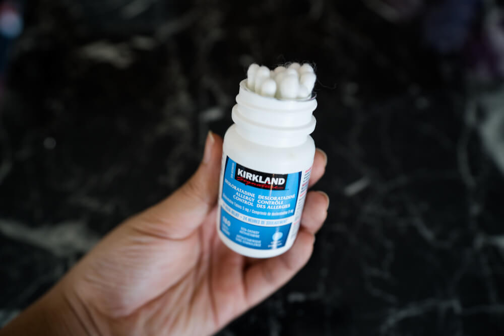 Q tips being stored in an old pill bottle