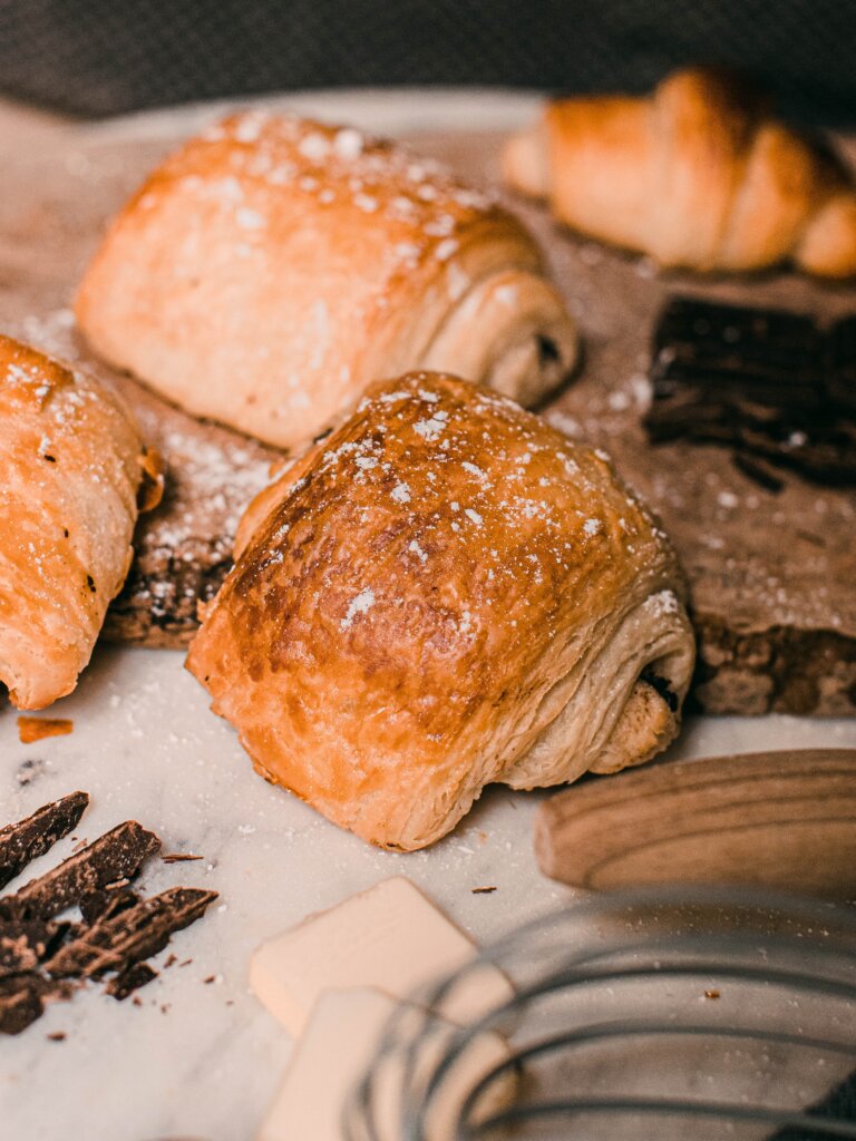 Pain au chocolats on a table during a baking class