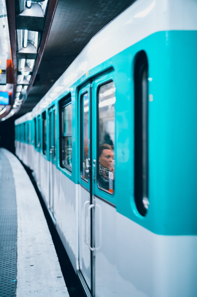 Turquoise Metro Car in Paris leaving the platform