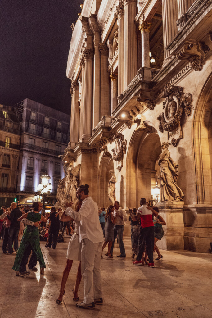 Dancers enjoying a dance in front of the Palais Garnier in Paris, France