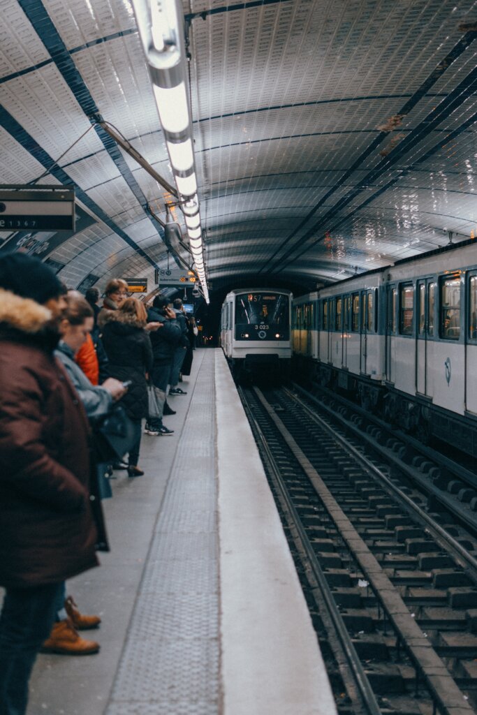 People waiting for the Metro at a station in Paris, France