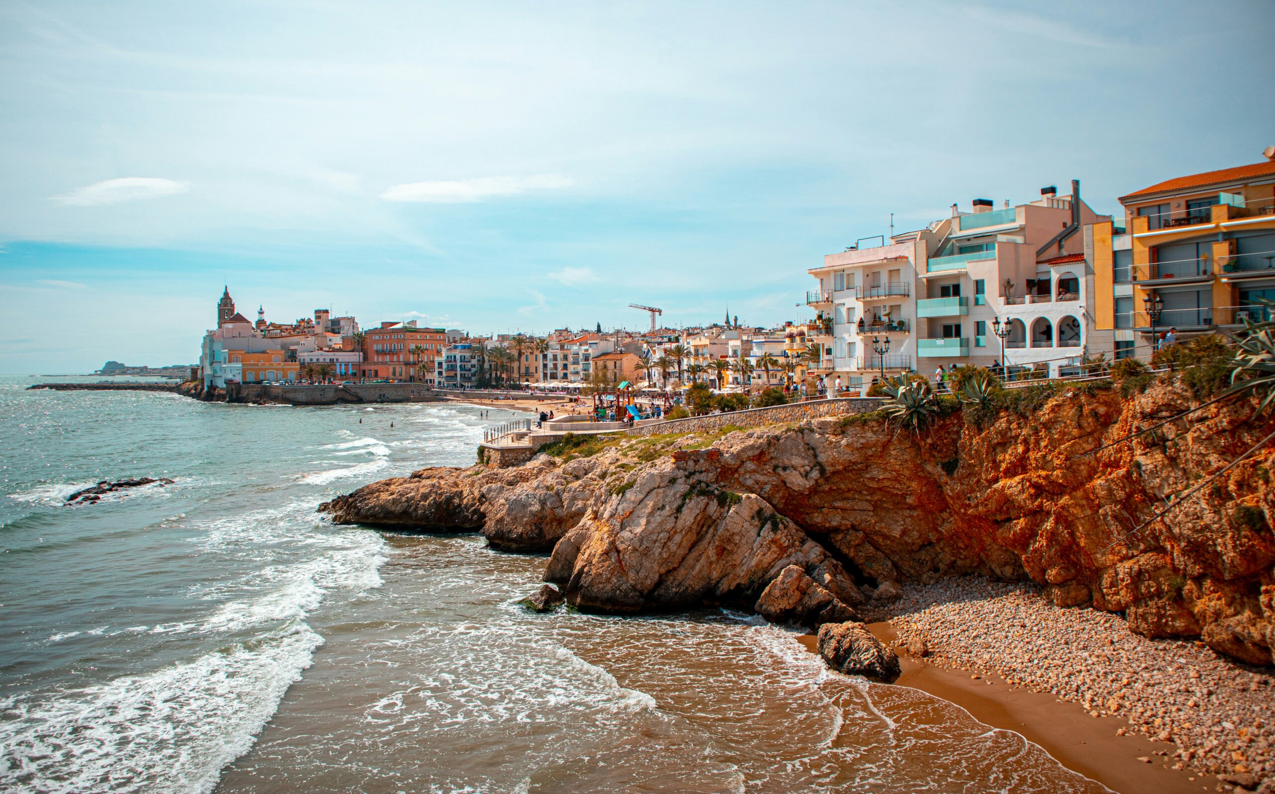 Beach and coloured houses in Sitges, Barcelona