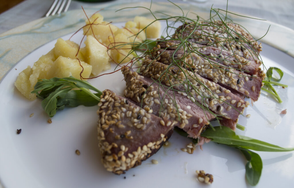 Seared tuna steak on a white plate from Soul and Fish in Sorrento Italy