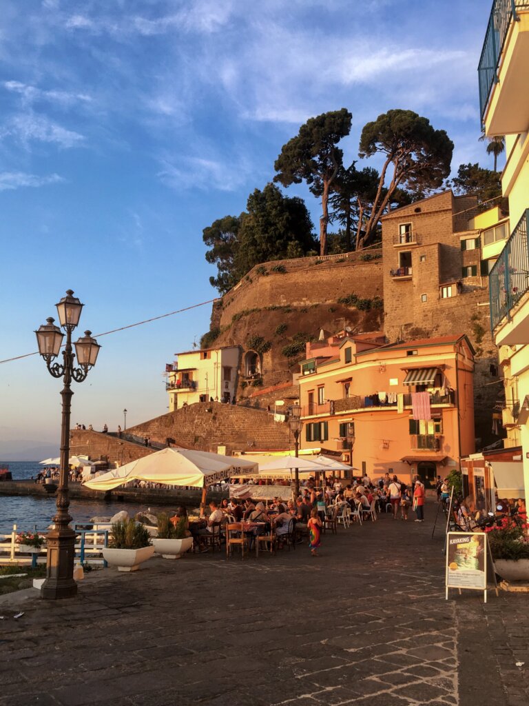 Boardwalk in Sorrento at sunset with restaurant diners