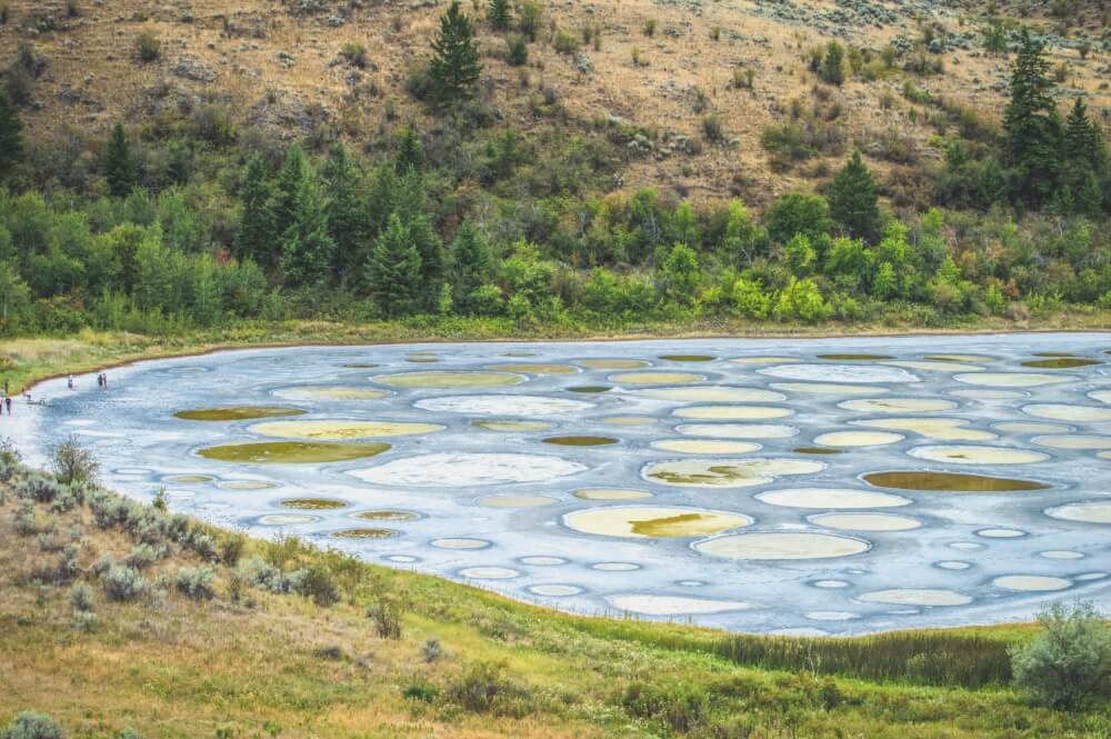 Polka dotted lake with blue and yellow spots in Osoyoos, BC, Canada