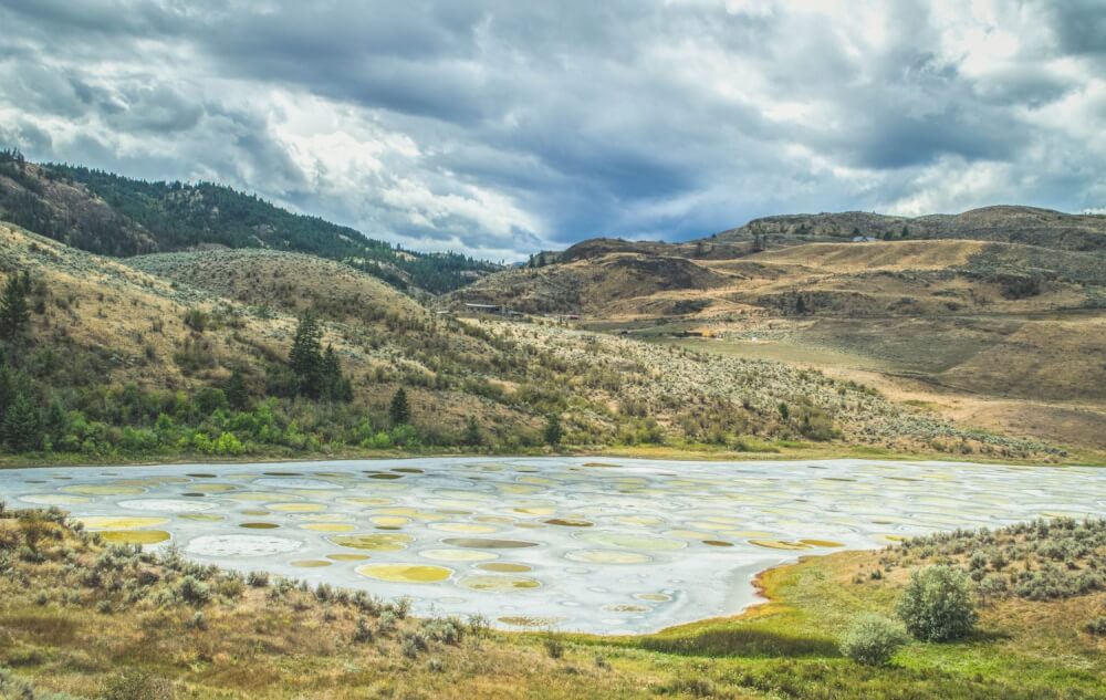 Polka dotted lake with blue and yellow spots in Osoyoos, BC, Canada