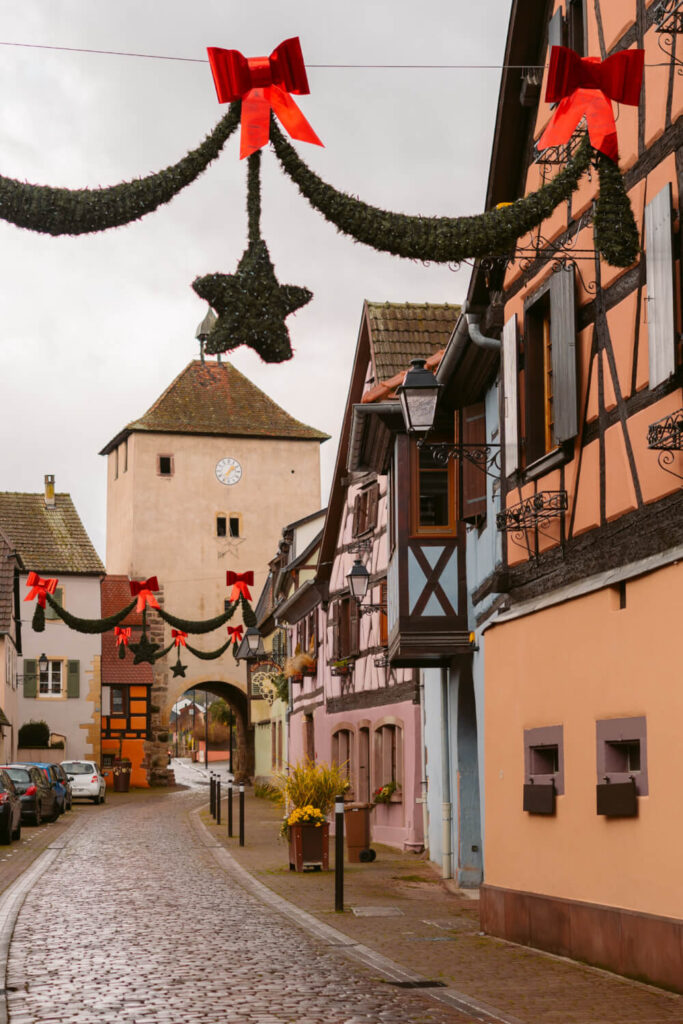 Cobblestoned street lined with half timbered houses in Turckheim, France