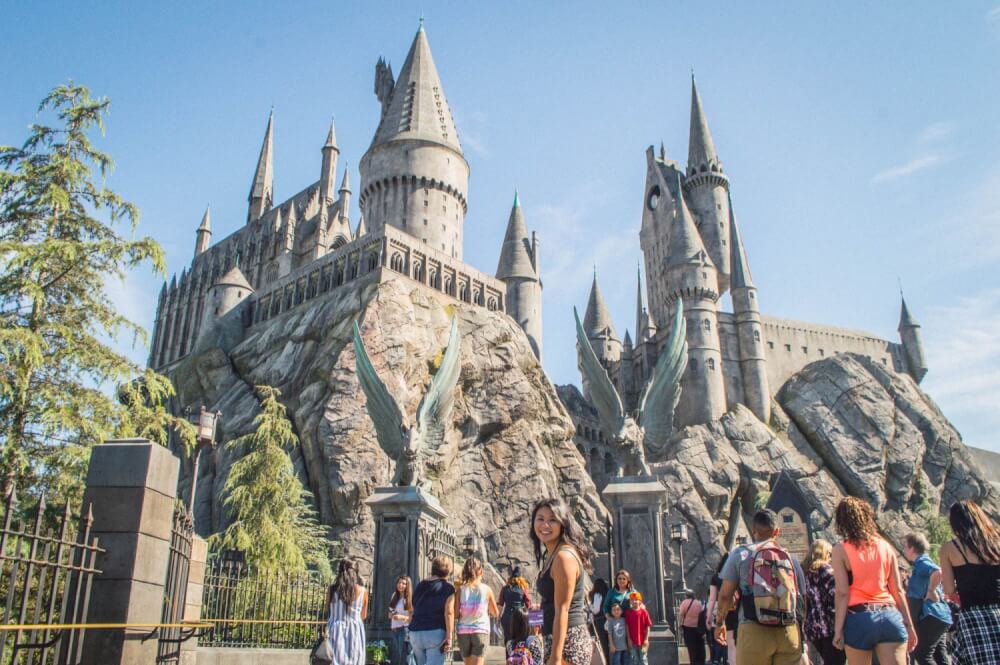 Girl posing in front of Universal Studios Hollywood Hogwarts