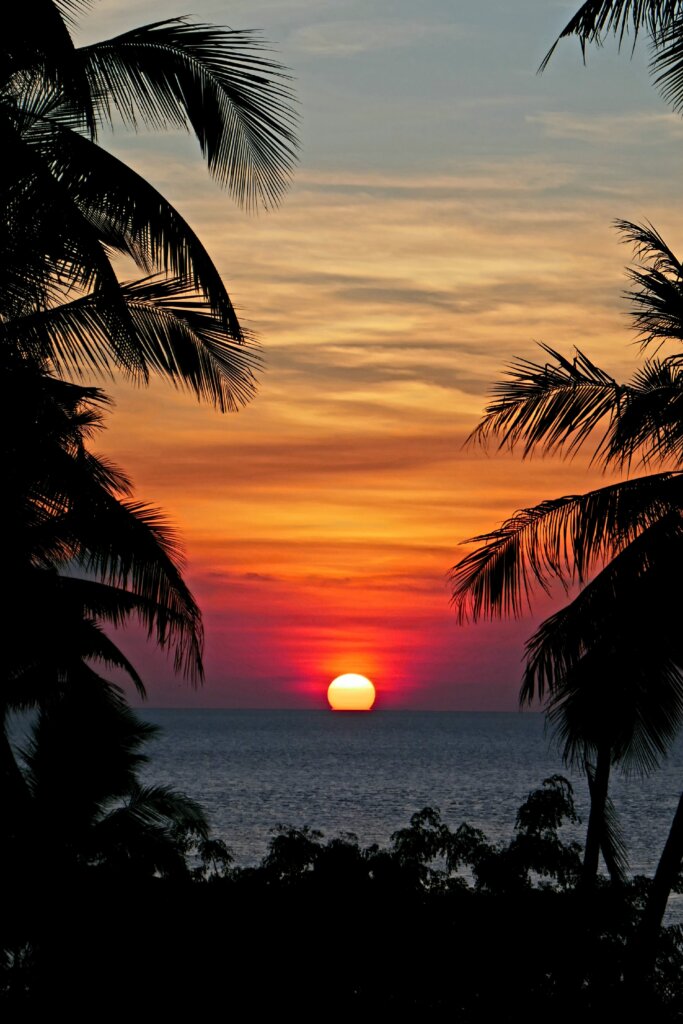 Sun setting over horizon in the Wakatobi Islands in Indonesia