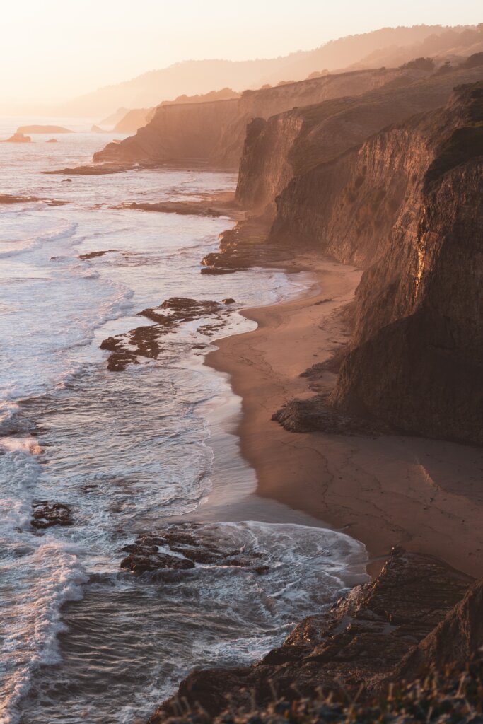 The California coastline and lapping tide, boasting countless rock formations.