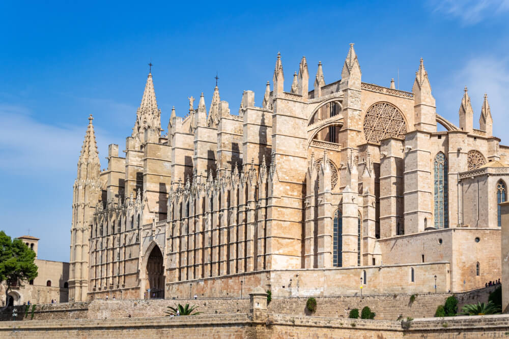 The massive Palma Cathedral with several spires and stained glass windows