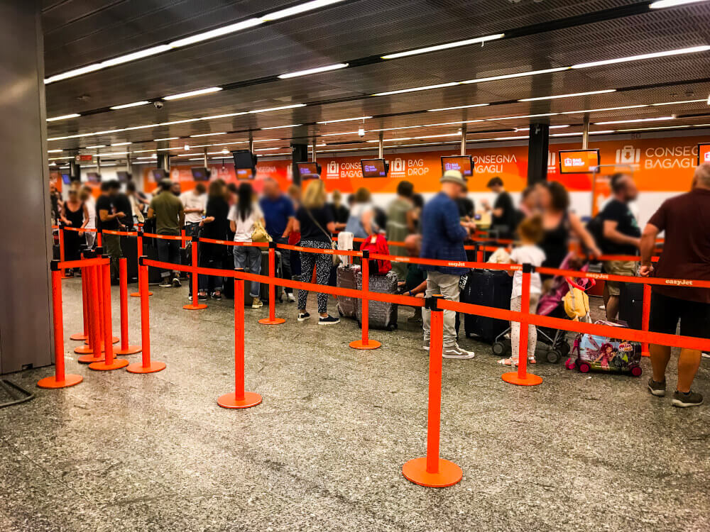 Passengers waiting in line at an easyJet check in area