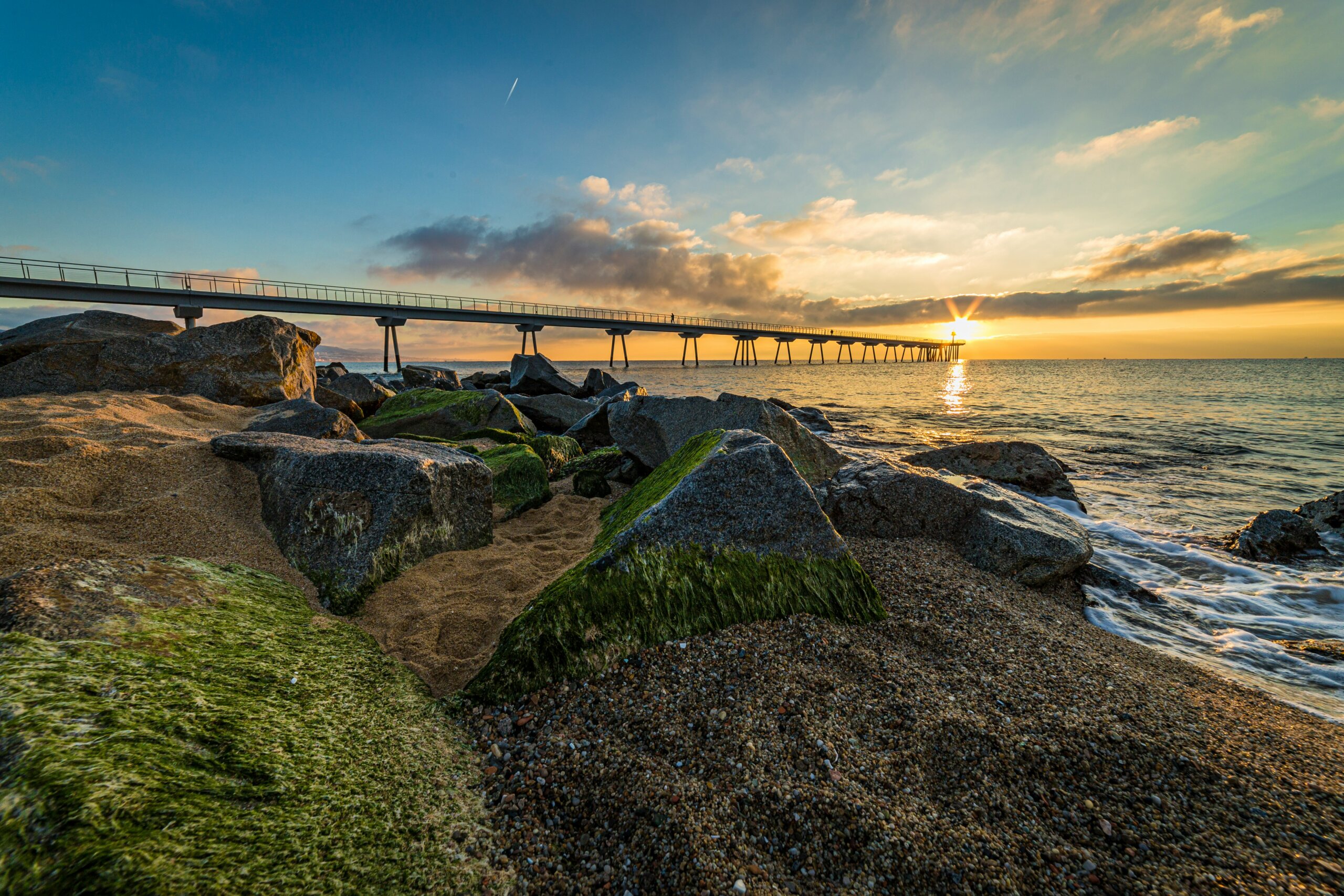 Sunset behind Pont del Petrol in Badalona, Spain